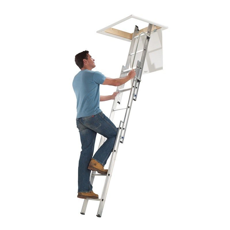 Man climbing up a loft ladder.