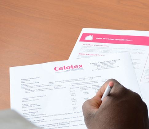 A person reading and marking a Celotex document.