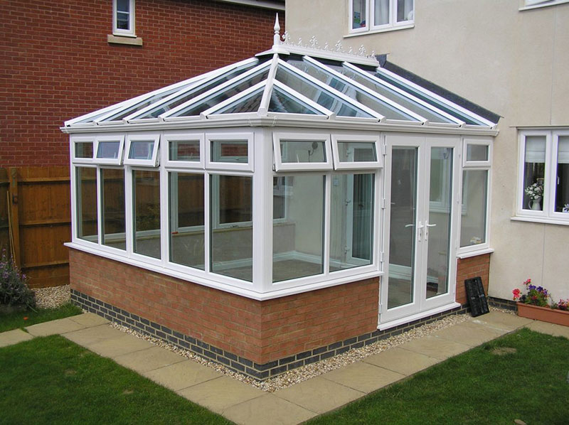 Attached insulated conservatory.